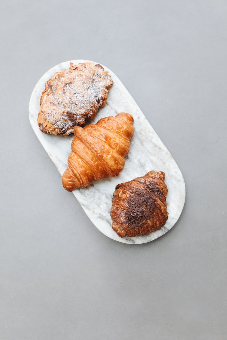 Overhead Shot Of Croissants On A Marble Surface