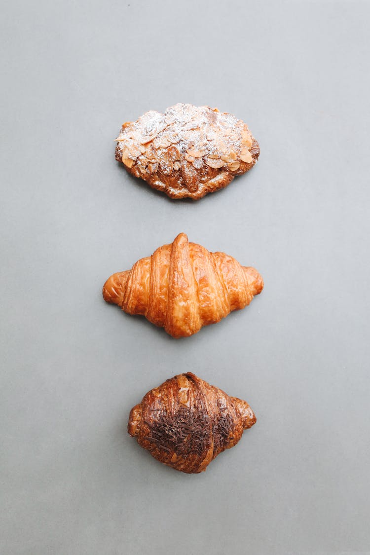 Overhead Shot Of Baked Croissants On A Gray Surface