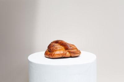 Cardamom knot bun on a plate — photo by Polina Tankilevitch on Pexels