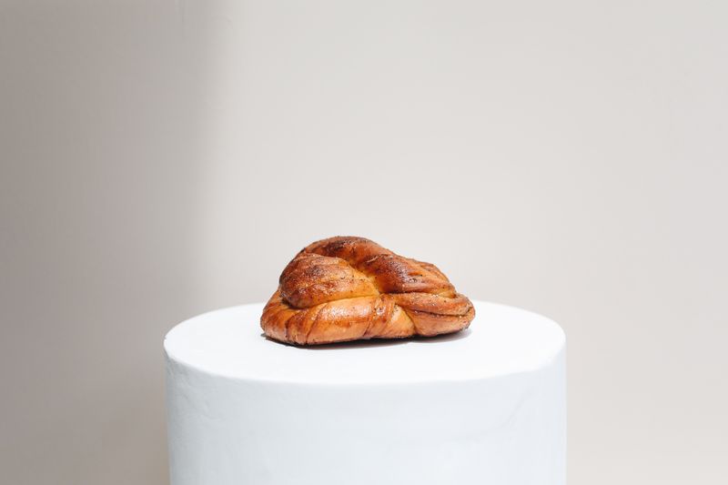 Close-up of a glazed cinnamon knot pastry