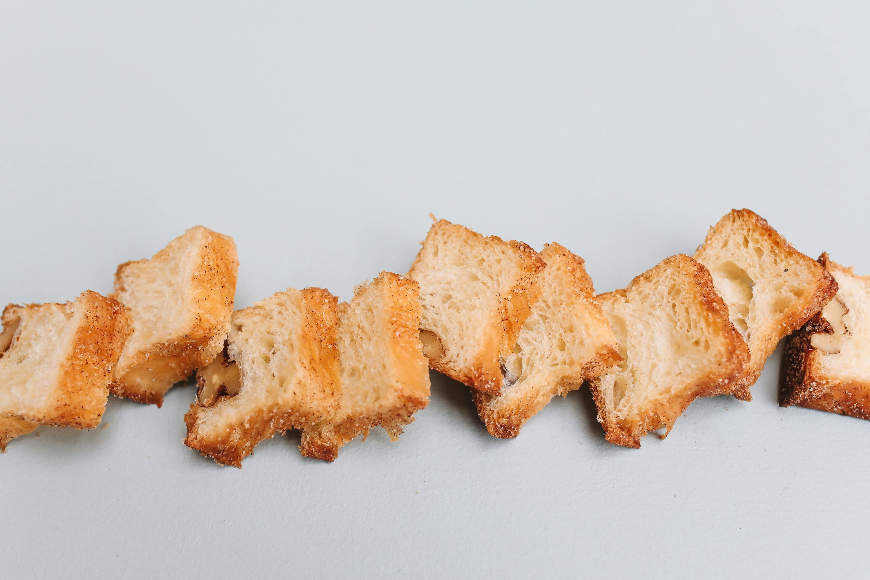 close up photo of slices of bread on a gray surface