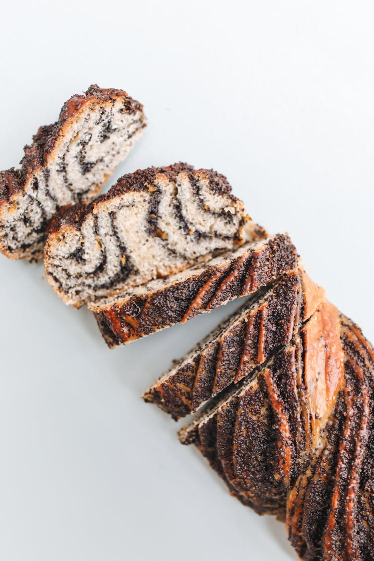 Slices Of Cinnamon Bread On White Surface