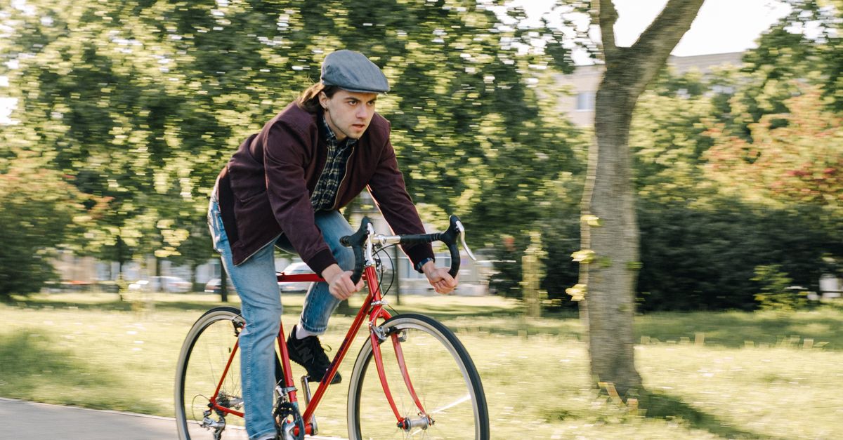 Person Riding Bike Red Photo of a Man Riding His Red Road Bike · Free Stock Photo