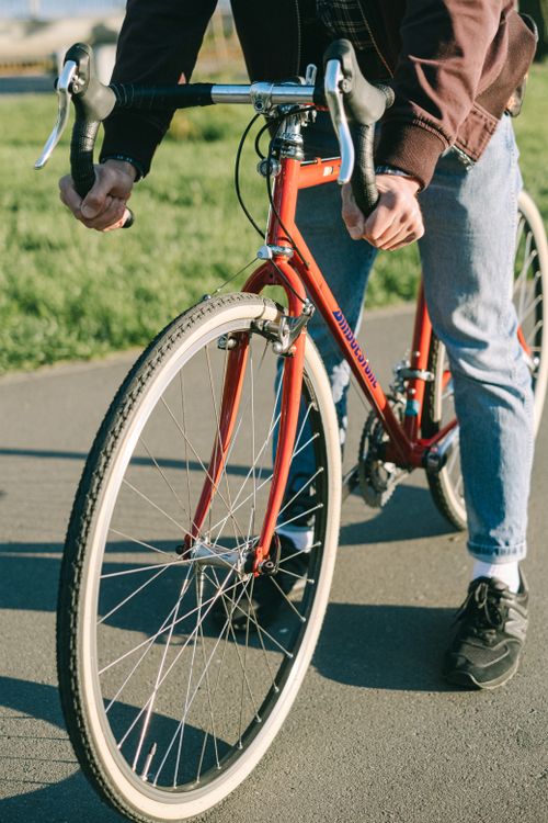Person Riding Bike Red Photo of a Person Riding a Red Bicycle · Free Stock Photo