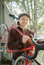 A Happy Man Carrying a Bicycle