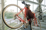 A Man Carrying a Bicycle