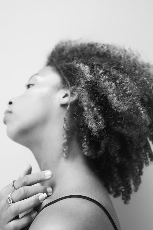 Grayscale Photo of a Woman with Curly Hair