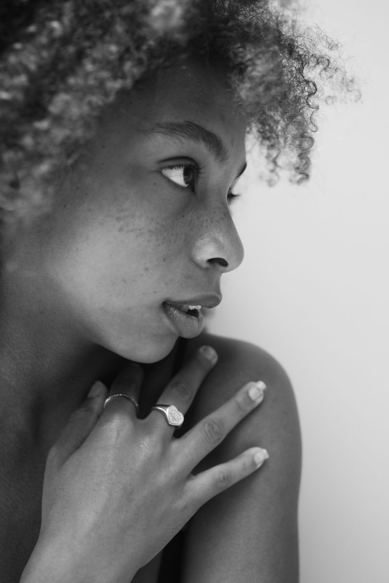 Nadia Okoye, curly-haired piercing artist