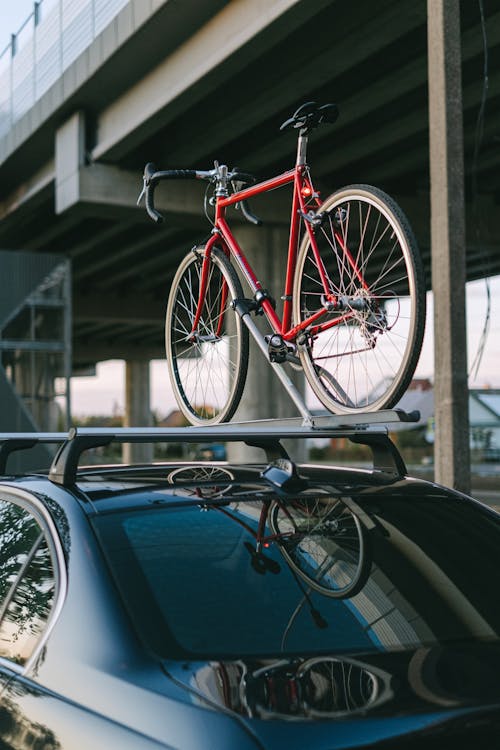 A Bike on the Roof Rack of a Car