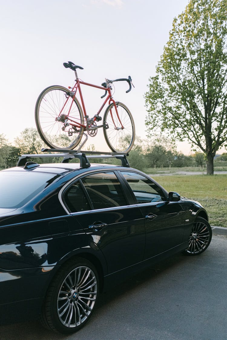 A Bike On The Roof Rack Of An Automobile