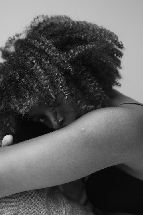 Grayscale Photo of Woman With Curly Hair