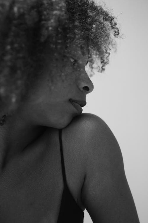 Free Grayscale Photo of a Woman with Curly Hair Stock Photo