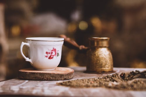 Free Close Up Photo of Teacup on Wooden Surface Stock Photo