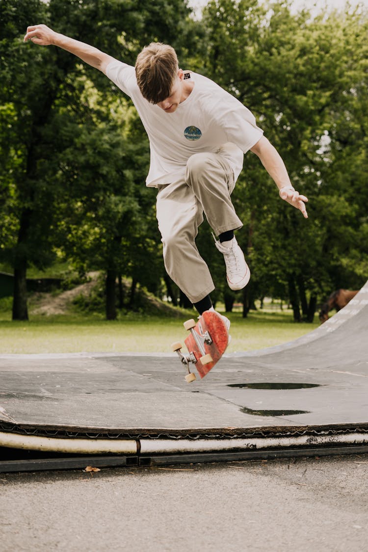 Man Doing Skateboard Tricks On Ramp 