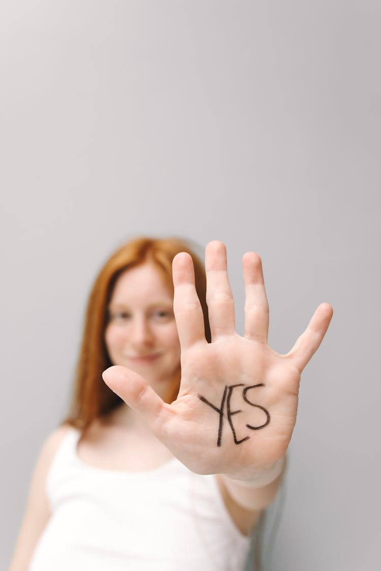 Woman's With Yes Word On Her Hand