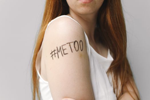 Woman With Me Too Written on Her Shoulder