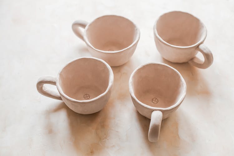 Empty Ceramic Cups On Table