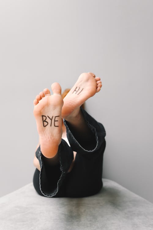 Selective Focus Photo of Person's Barefoot