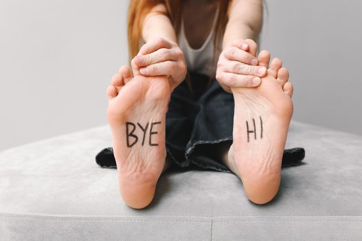 Photo of Black Text on a Person's Feet