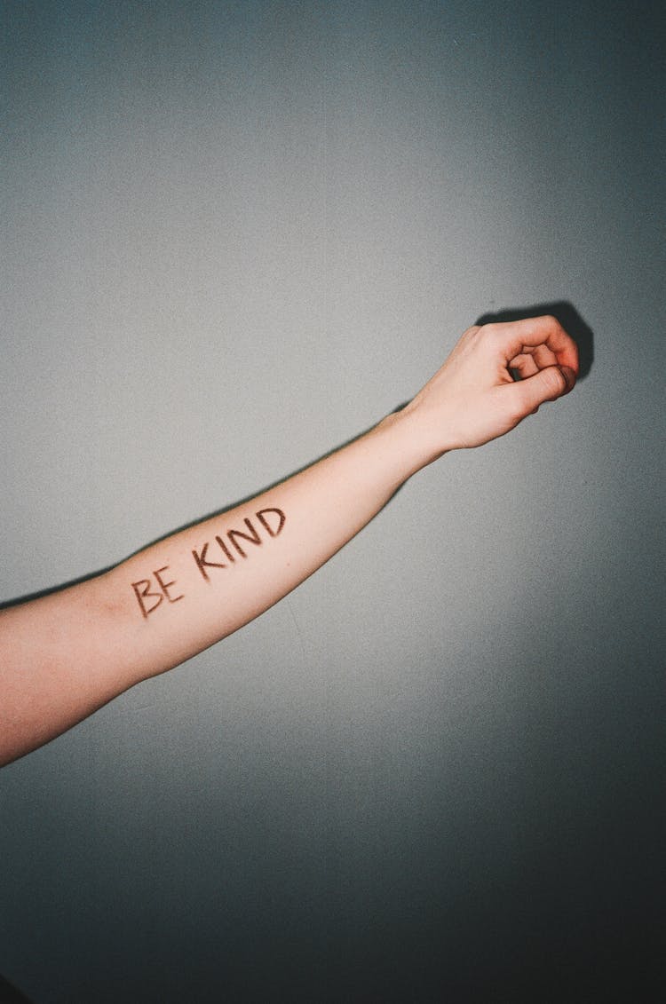 Be Kind Written On The Person's Forearm 