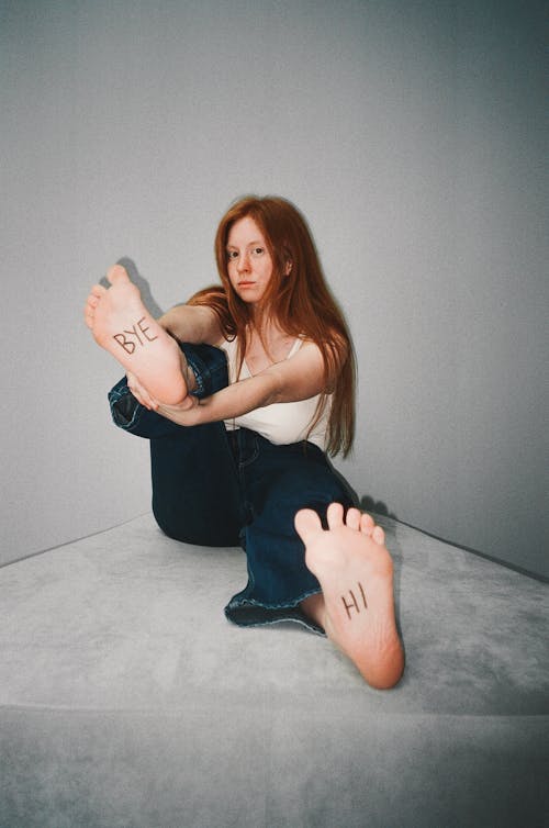 Brunette Woman with Message on Her Soles 