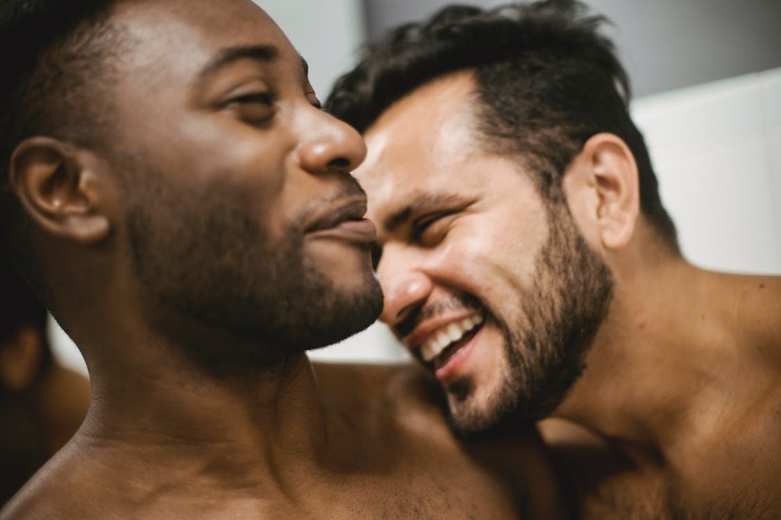 Free Topless Men Smiling in Front of the Camera Stock Photo