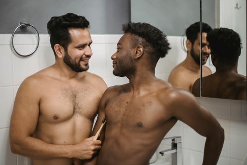 Free A tender moment captured between a couple in a bathroom, symbolizing love and togetherness. Stock Photo