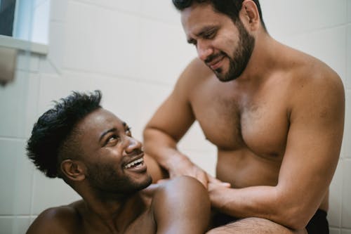 Shirtless Men Sitting Together