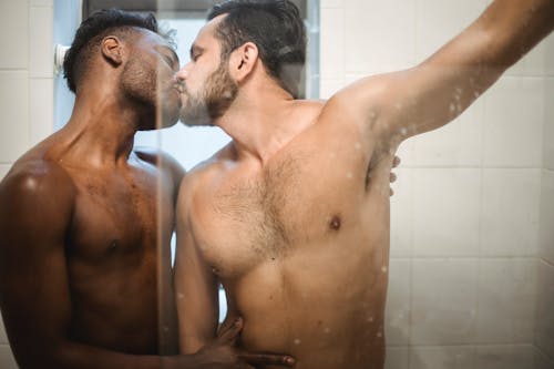 Free Two Men Kissing in the Shower Stock Photo
