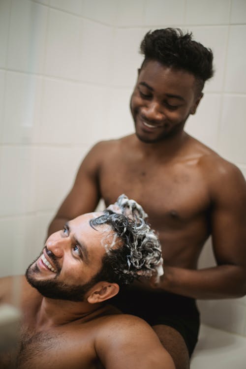 Man Washing Another Man's Hair