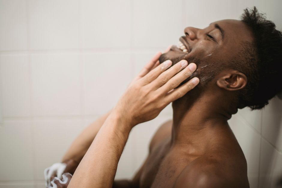 man washing braids proper technique shower