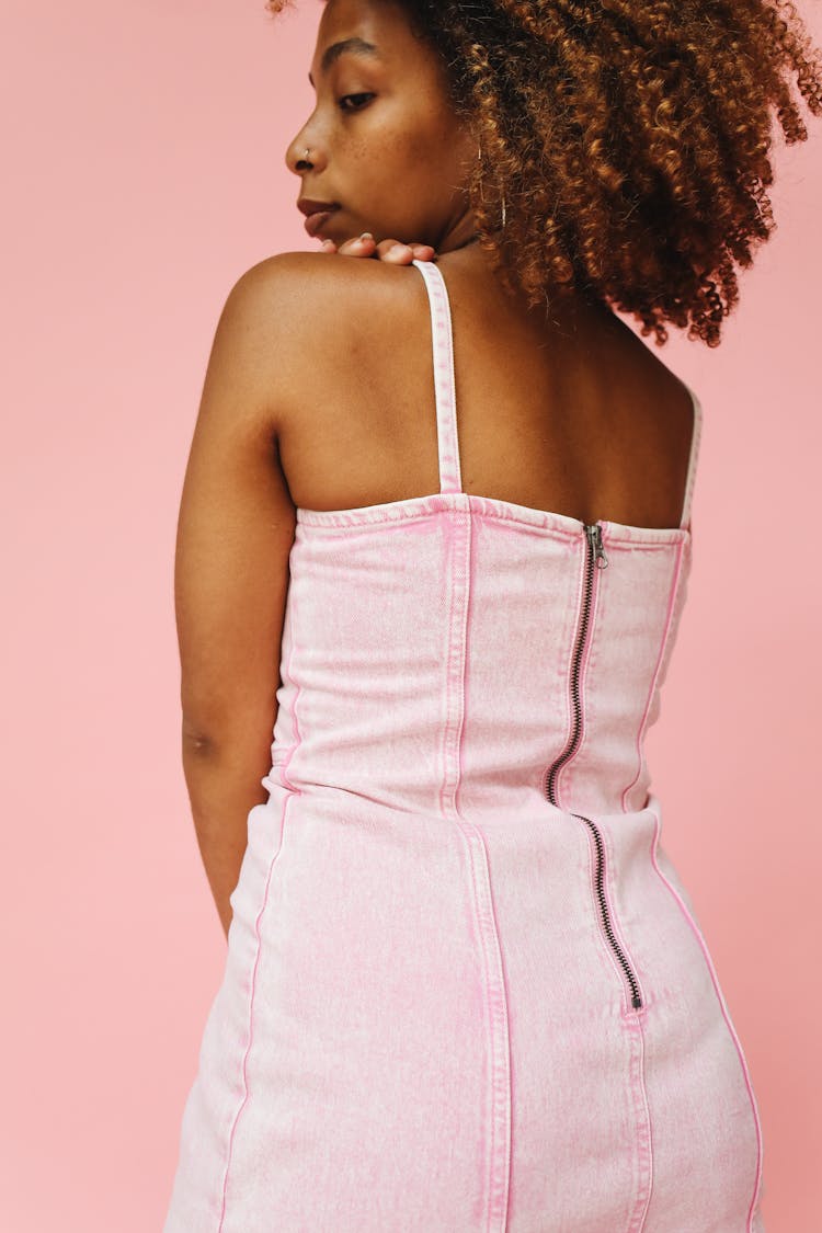 Back View Of A Girl Wearing A Pink Dress