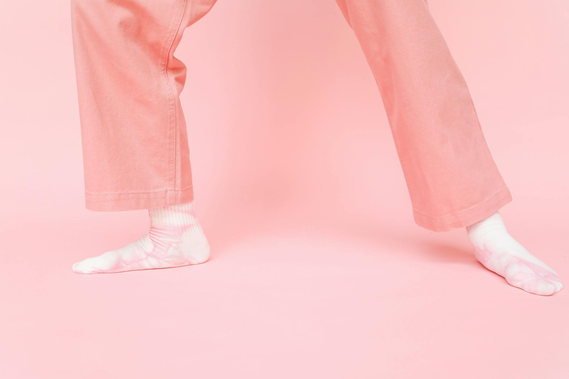 Pastel Pink Clothing In A Serene Outdoor Setting With Soft Lighting, Promoting A Harmonious And Peaceful Atmosphere