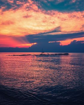 Picturesque view of colorful cloudy sky above rippling sea at sunset time in tropical country in summer time in nature
