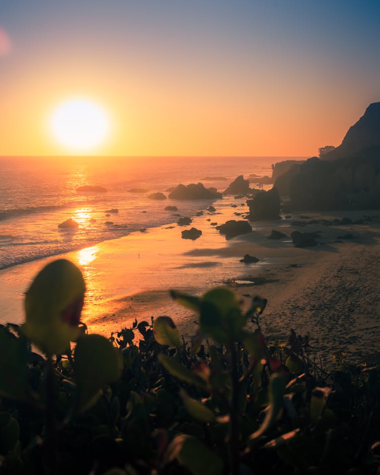 Picturesque Sunset Sky Over Sea And Mountains