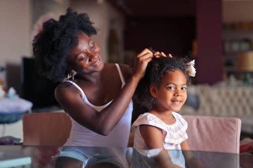 Mother Making Daughter Hair