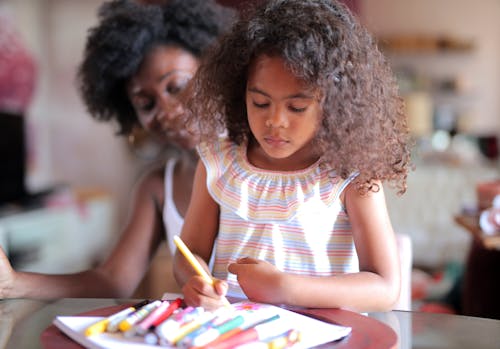 Photo of a Girl Drawing