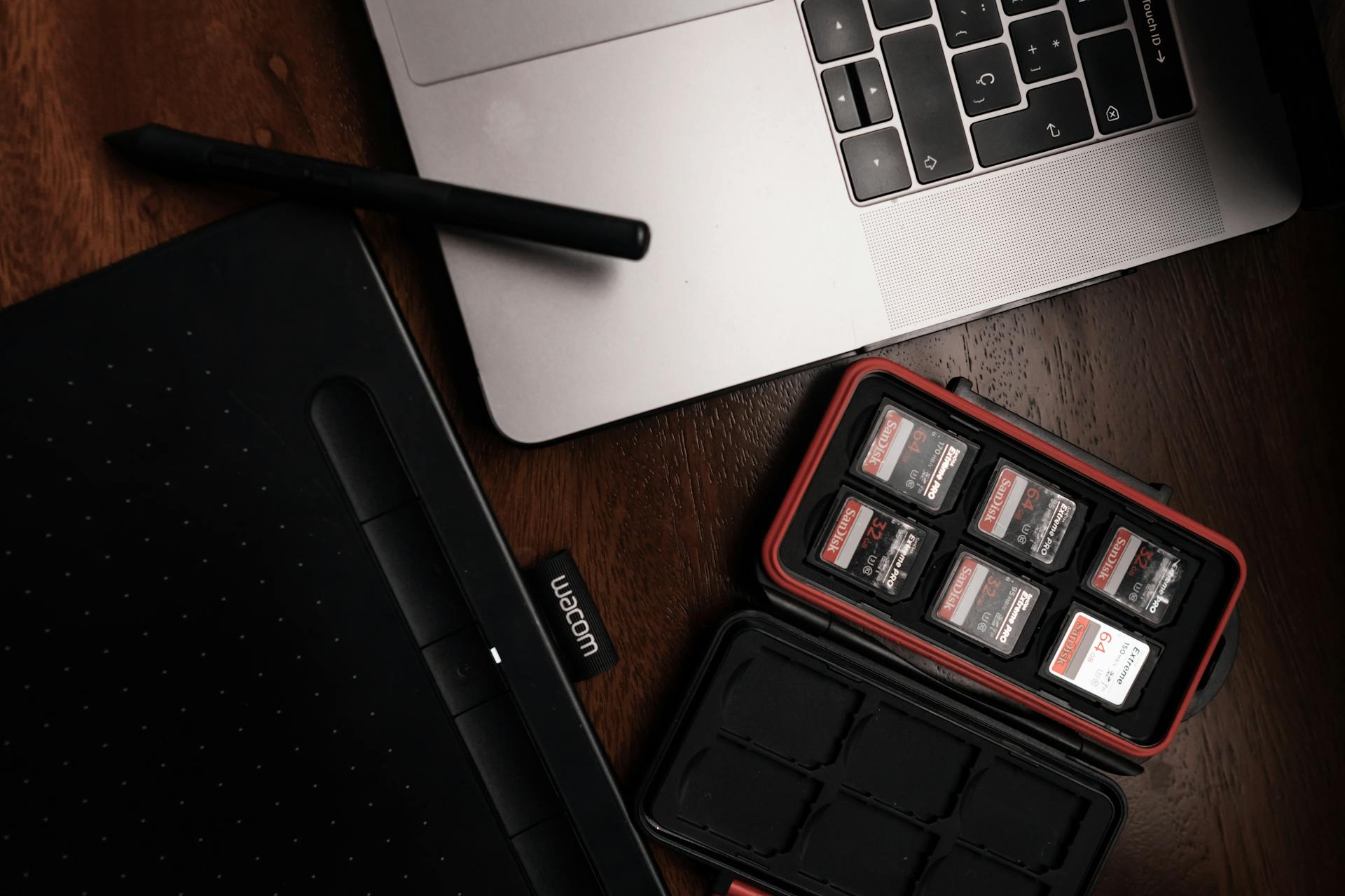 Close up of Memory Cards Next to a Laptop