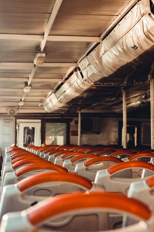 Free A row of empty seats on a Turkish ferry showcasing modern interior design and transportation system. Stock Photo