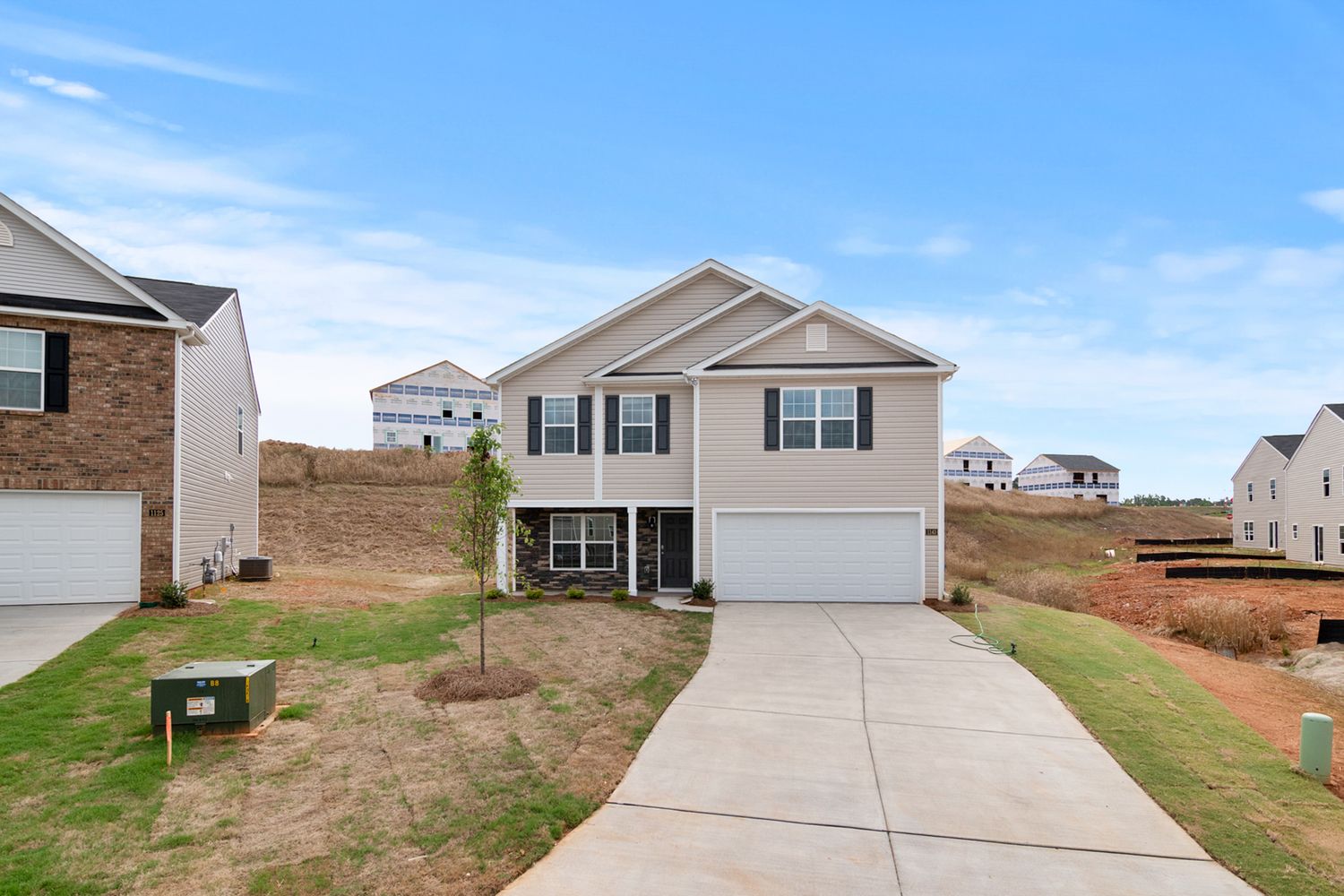 Suburban house with driveway and front lawn