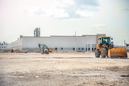 Yellow and Black Heavy Equipment on the Field