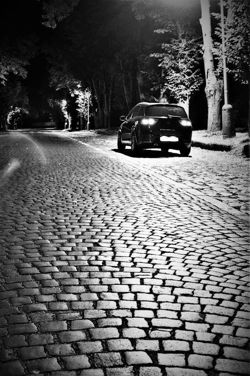 Free stock photo of black car, car, cobblestone