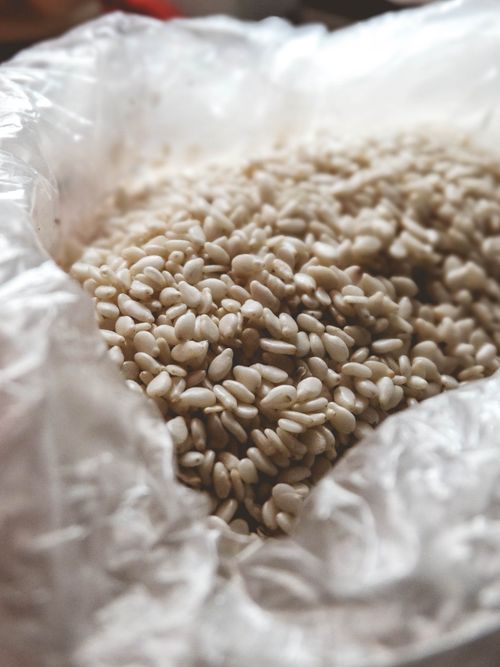 Free Macro shot of organic sesame seeds inside a plastic bag, showcasing texture and detail. Stock Photo