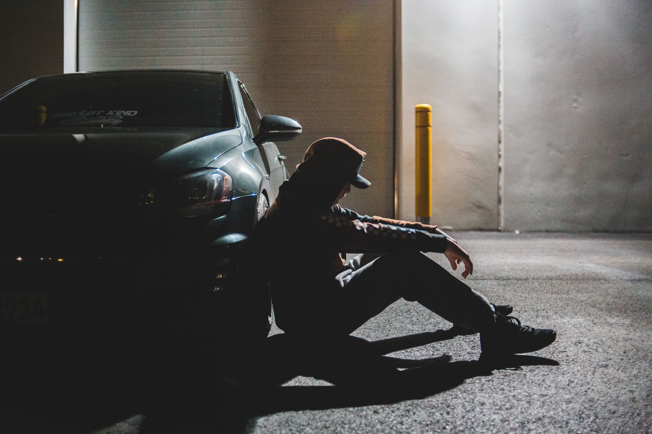 side view of thoughtful unrecognizable male driver in casual outfit re