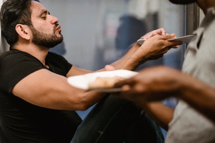 Men Eating From Paper Plates