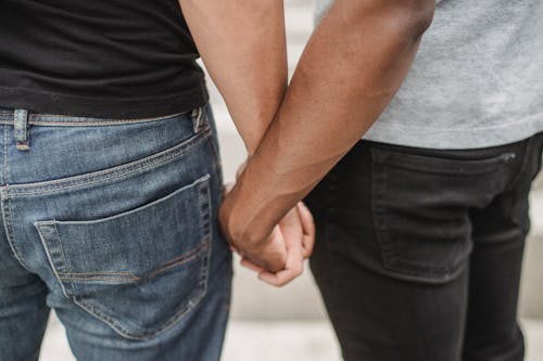 Free Close up of a Couple Holding Hands Stock Photo