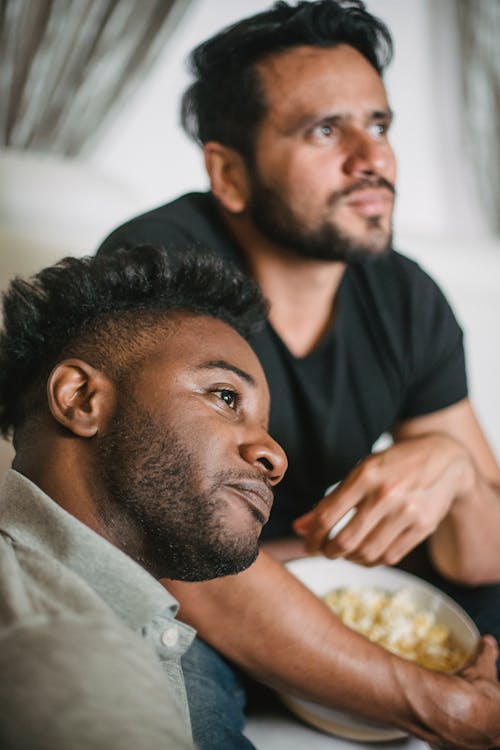 Free A Couple Sitting with Popcorn Stock Photo