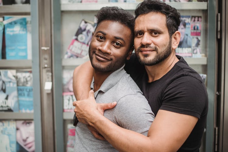 A Sweet Couple Smiling At The Camera