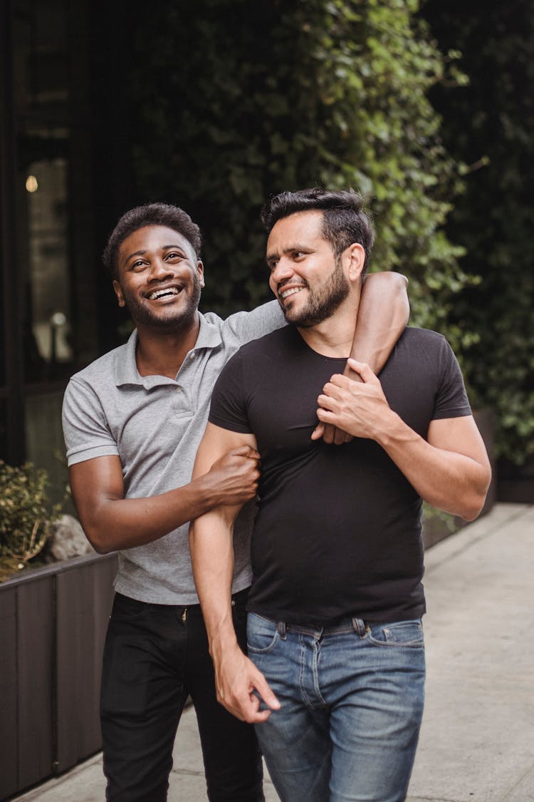 A Happy Couple Walking Together On The Street