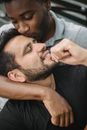 Man in Black Shirt Holding His Face